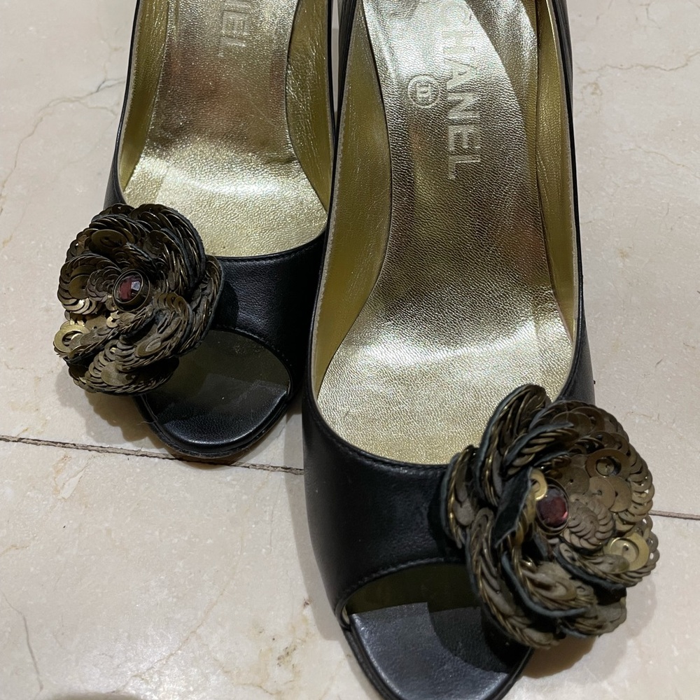 Chanel black heels with a flower
